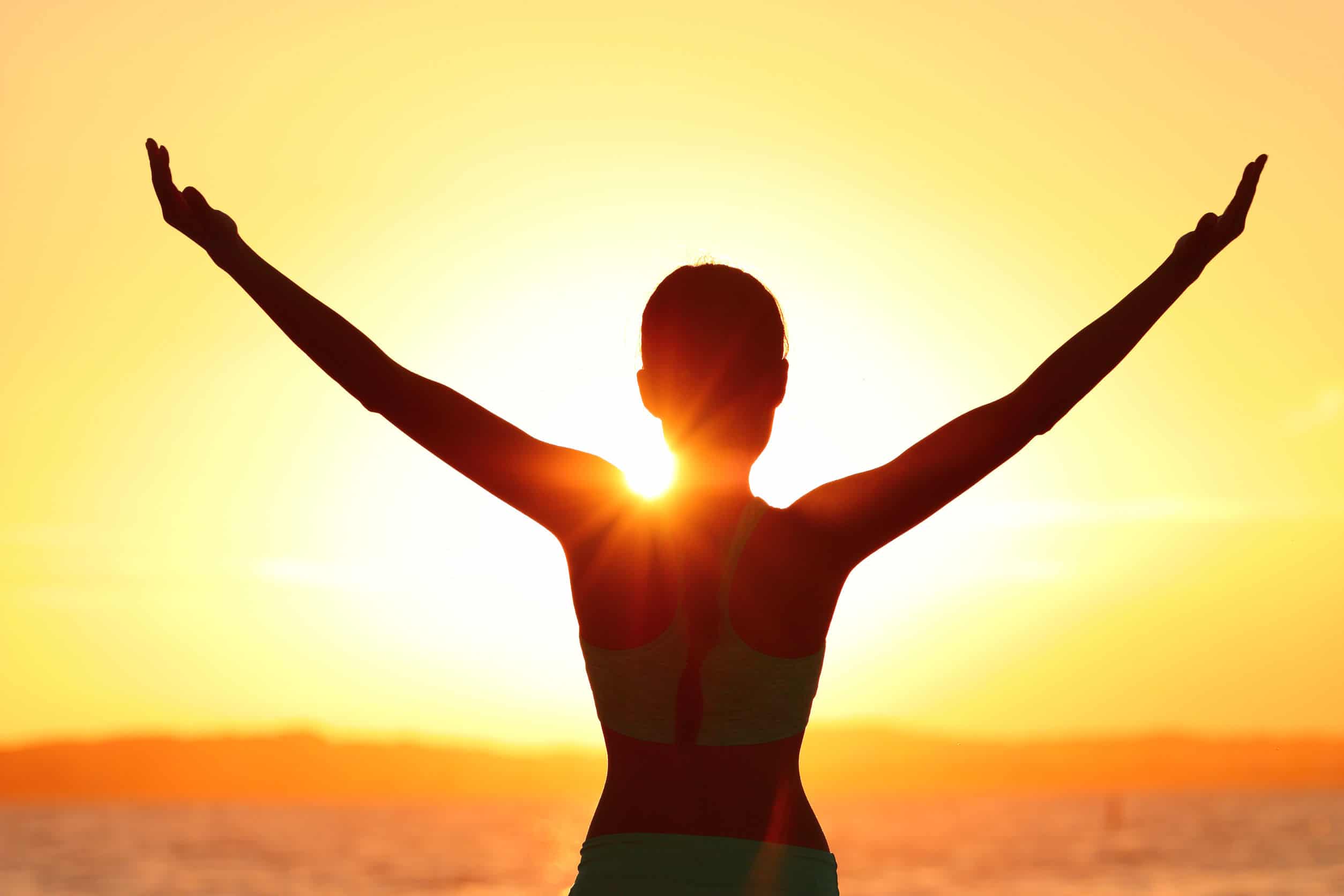 Freedom Woman With Open Arms Silhouette In Sunrise Against Sun Flare Morning Yoga Girl